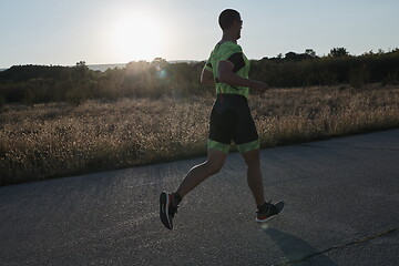 Image showing triathlon athlete running on morning trainig