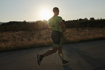 Image showing triathlon athlete running on morning trainig