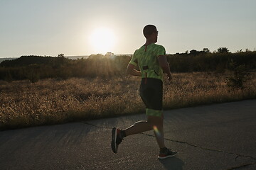 Image showing triathlon athlete running on morning trainig