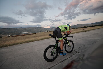 Image showing triathlon athlete riding a bike