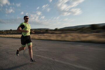 Image showing triathlon athlete running on morning trainig