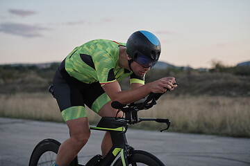 Image showing triathlon athlete riding a bike