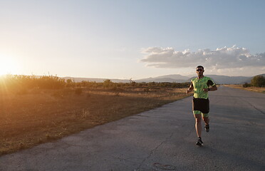 Image showing triathlon athlete running on morning trainig