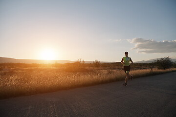 Image showing triathlon athlete running on morning trainig
