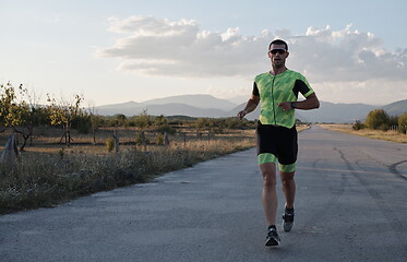 Image showing triathlon athlete running on morning trainig