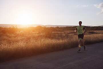 Image showing triathlon athlete running on morning trainig