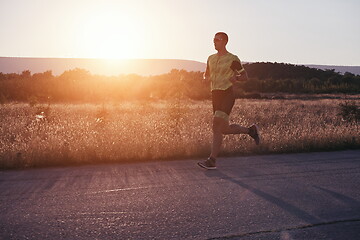 Image showing triathlon athlete running on morning trainig