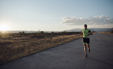 Image showing triathlon athlete running on morning trainig