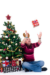 Image showing Happy girl catching a present