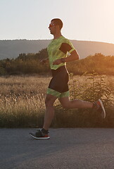 Image showing triathlon athlete running on morning trainig