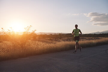 Image showing triathlon athlete running on morning trainig