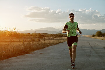 Image showing triathlon athlete running on morning trainig