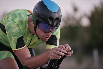 Image showing triathlon athlete riding a bike