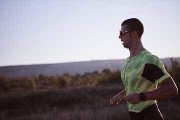 Image showing triathlon athlete running on morning trainig