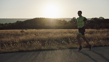 Image showing triathlon athlete running on morning trainig