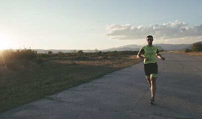 Image showing triathlon athlete running on morning trainig