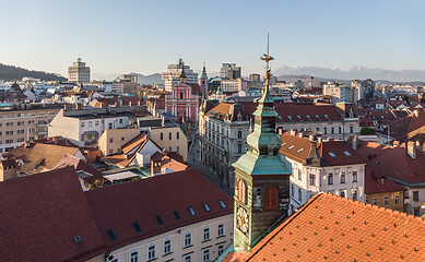 Image showing Scenic panoramic aerial drone view of rooftops of medieval city center, town hall and cathedral church in Ljubljana, capital of Slovenia, at sunset