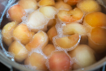 Image showing peeled boiled apples in a sugar syrup