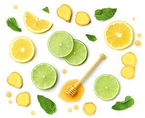 Image showing honey spoon, ginger and citrus fruit slices