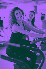 Image showing Group of people running on treadmills