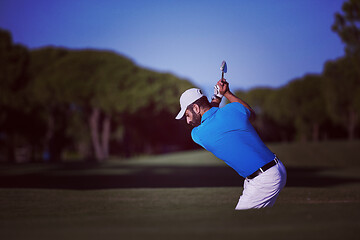 Image showing pro golfer hitting a sand bunker shot