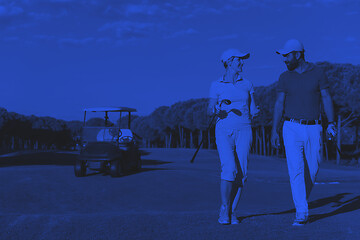 Image showing couple walking on golf course