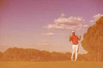 Image showing golf player hitting long shot