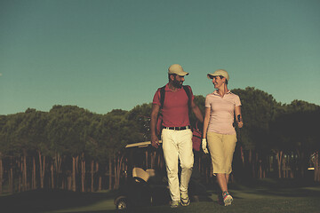 Image showing couple walking on golf course