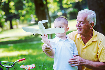 Image showing grandfather and child have fun  in park