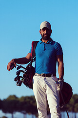 Image showing golfer  portrait at golf course on sunset