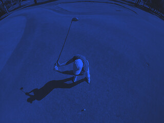 Image showing top view of golf player hitting shot