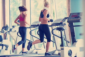 Image showing woman exercising on treadmill in gym