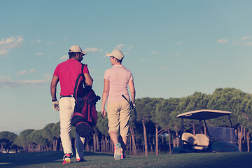 Image showing couple walking on golf course