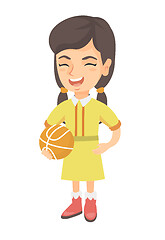 Image showing Laughing schoolgirl holding a basketball ball.