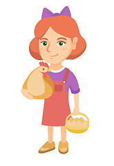 Image showing Caucasian girl holding a chicken and hen eggs.