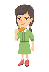 Image showing Caucasian girl eating roasted chicken leg.