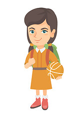 Image showing Schoolgirl with backpack holding a basketball.