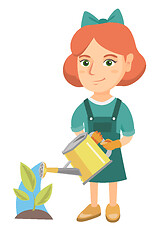 Image showing Caucasian girl watering plant with a watering can.