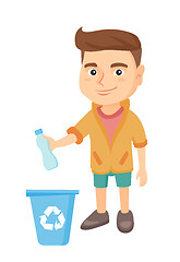 Image showing Boy throwing plastic bottle in recycle bin.