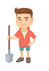 Image showing Caucasian smiling boy holding a shovel.