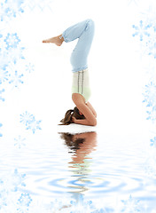 Image showing salamba sirsasana supported headstand on white sand