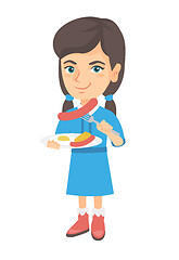 Image showing Girl eating sausage and fried egg for breakfast.