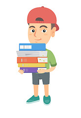 Image showing Caucasian school child holding pile of textbooks.