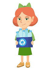 Image showing Girl holding recycling bin full of plastic bottles