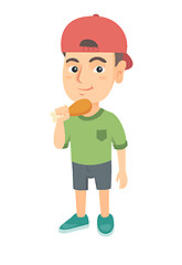 Image showing Caucasian boy eating roasted chicken leg.