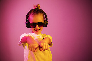 Image showing Young girl with headphones enjoying music