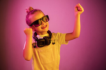 Image showing Young girl with headphones enjoying music