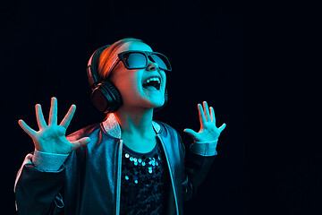 Image showing Young girl with headphones enjoying music