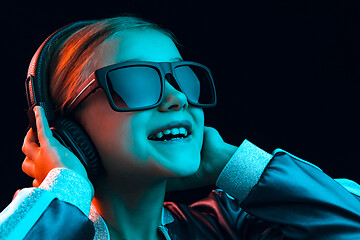 Image showing Young girl with headphones enjoying music