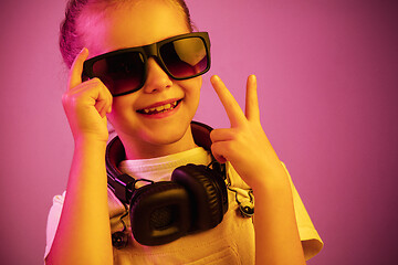 Image showing Young girl with headphones enjoying music